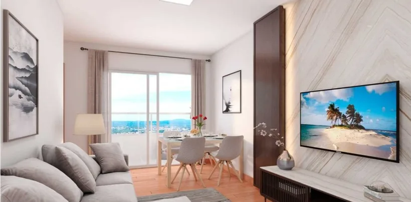 Sala de apartamento com TV exibindo canal da Qest TV